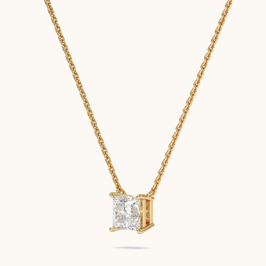Princess-cut lab-grown diamond pendant on a yellow-gold chain, three-quarter side view