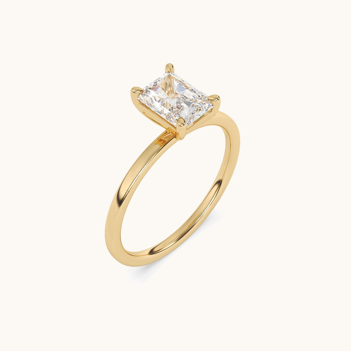 Radiant-cut lab-grown diamond solitaire ring in yellow gold, angled upright view