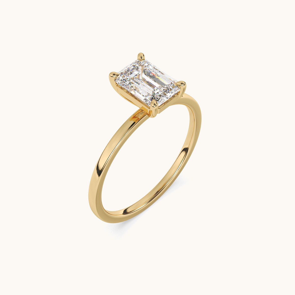 Emerald-cut lab-grown diamond solitaire ring in yellow gold, angled upright view
