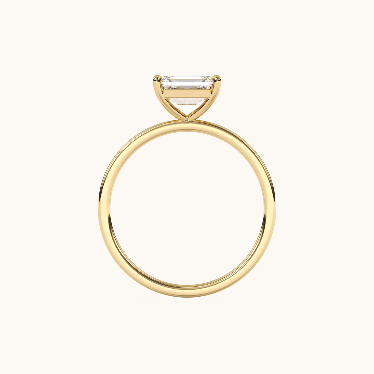 East-to-west emerald-cut lab-grown diamond solitaire ring in yellow gold, overhead view
