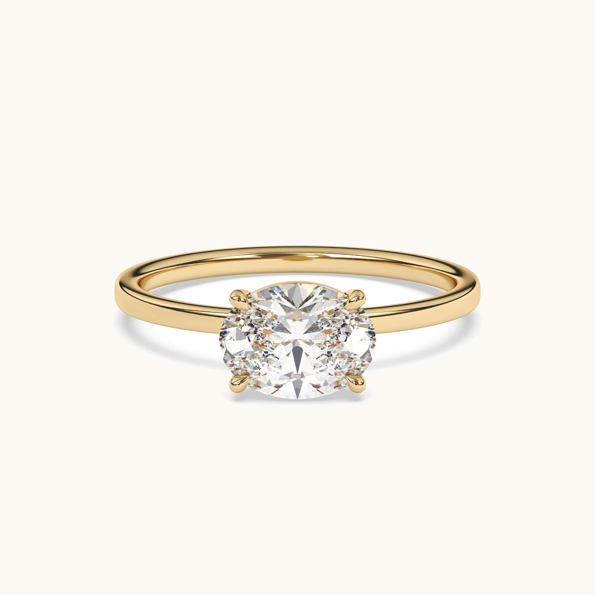 East-to-west oval lab-grown diamond solitaire ring in yellow gold, low side profile