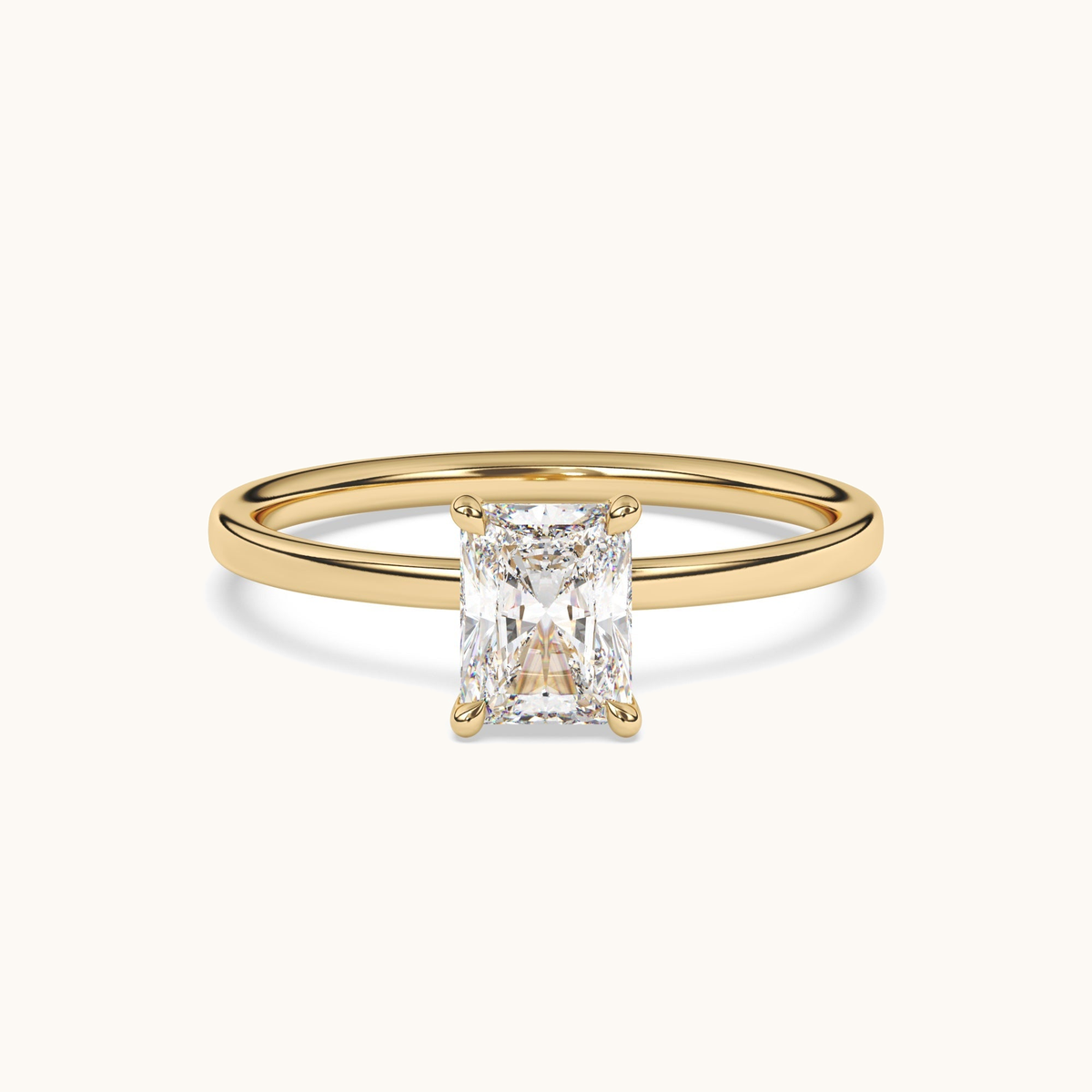 Radiant-cut lab-grown diamond solitaire ring in yellow gold, low side profile