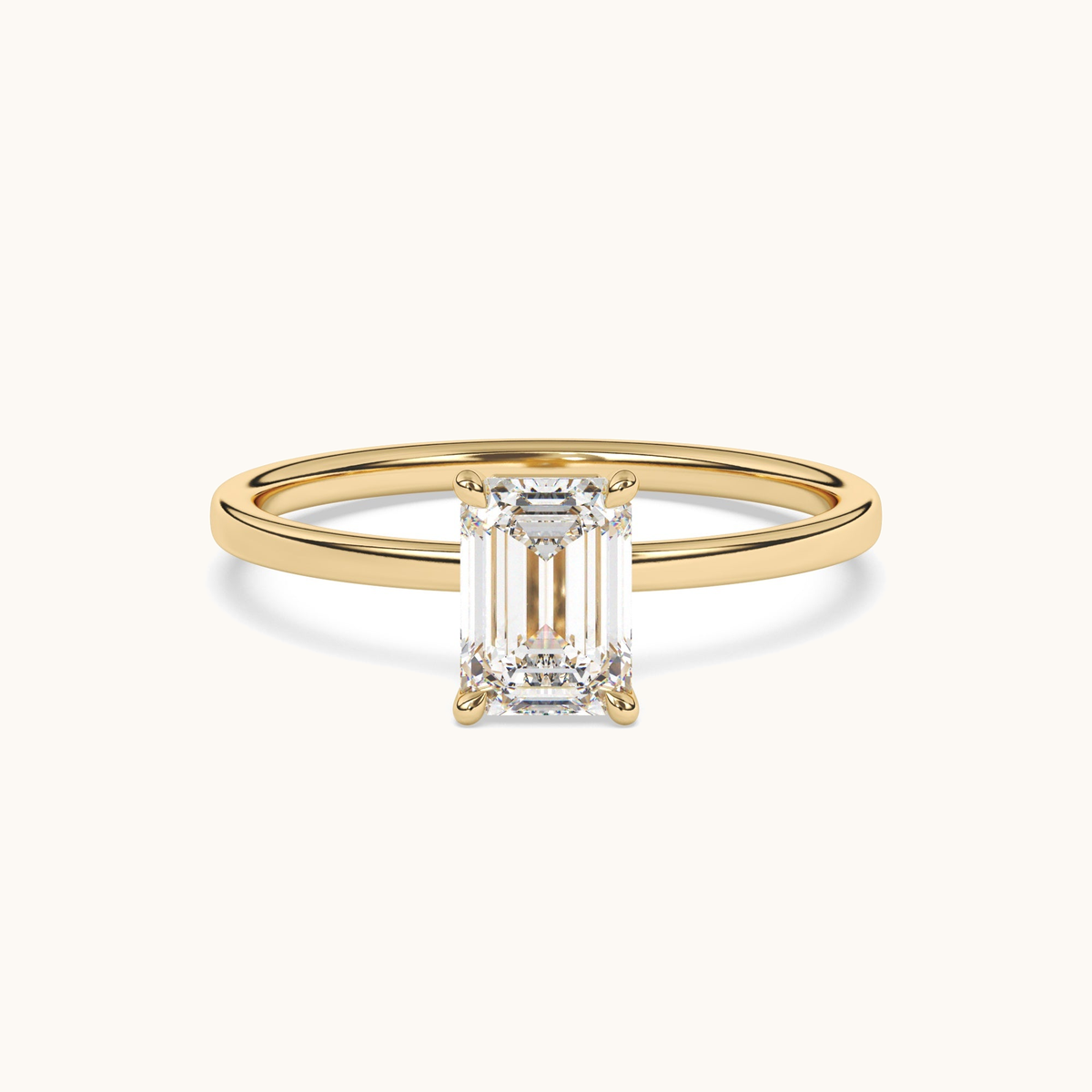 Emerald-cut lab-grown diamond solitaire ring in yellow gold, low side profile