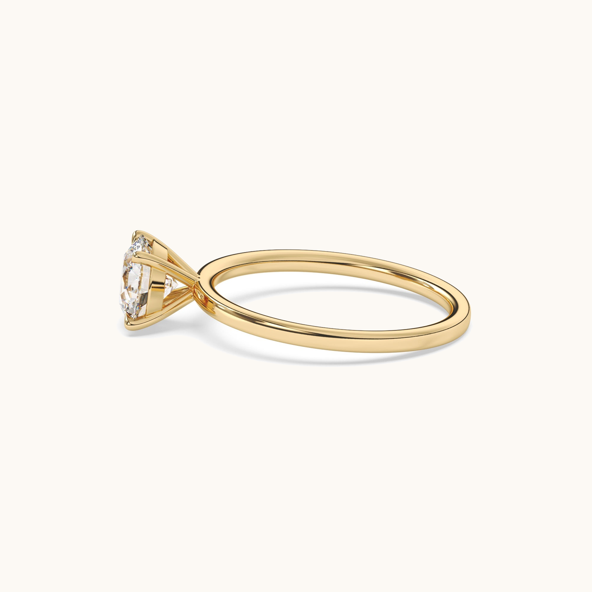 Round brilliant lab-grown diamond solitaire ring in yellow gold, low front view