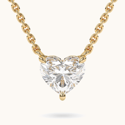 Heart-shaped lab-grown diamond pendant in yellow gold, close-up front view