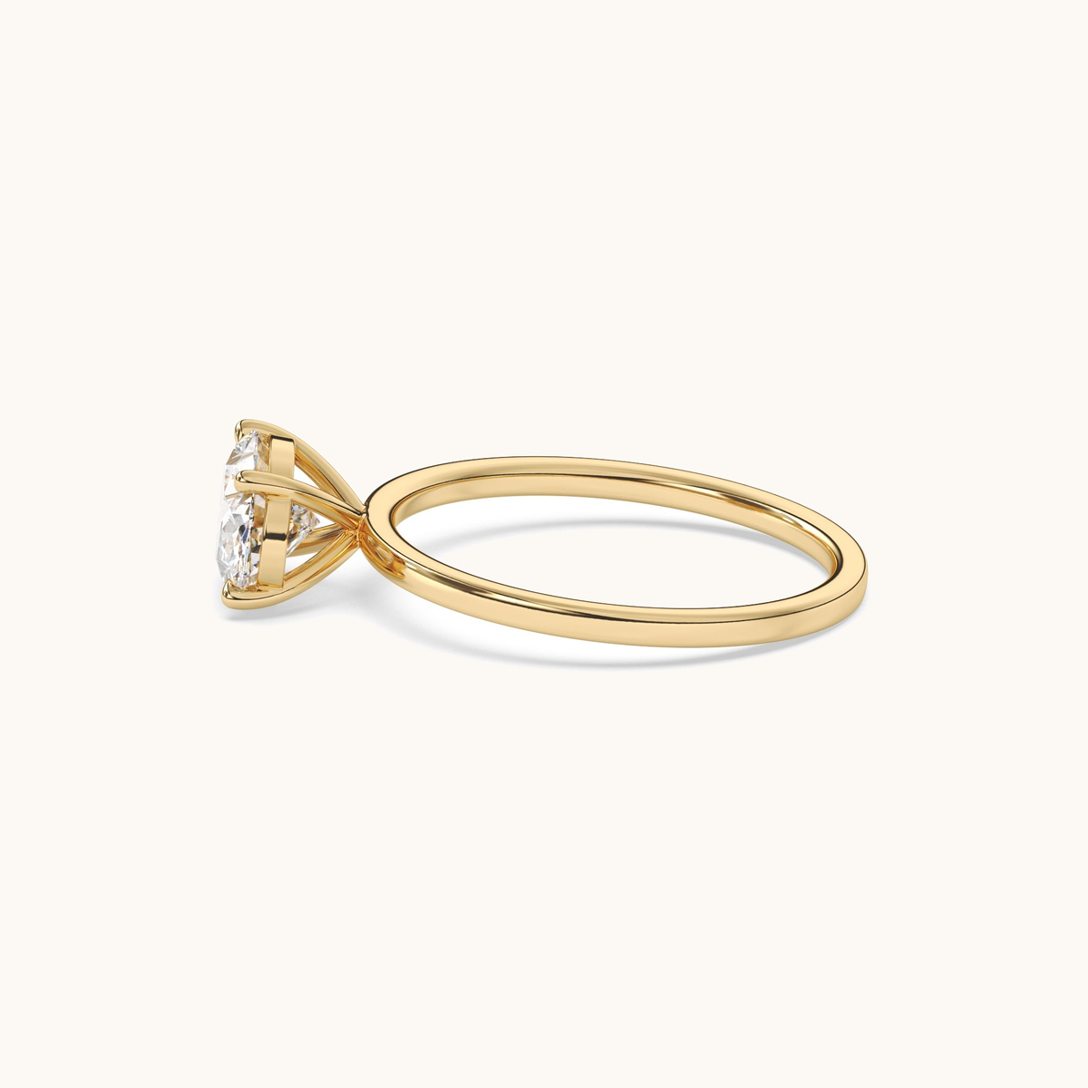 East-to-west oval lab-grown diamond solitaire ring in yellow gold, low front view
