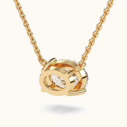 Oval lab-grown diamond pendant on a yellow-gold chain, rear view of the open-backed setting