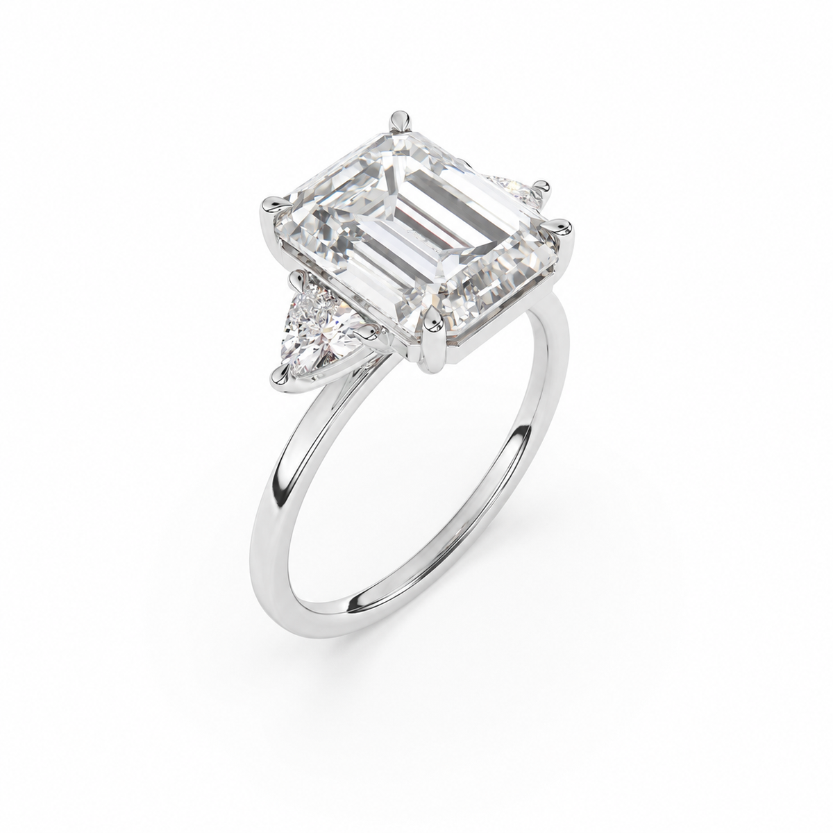 Emerald-cut diamond three-stone ring with trillion diamond shoulders