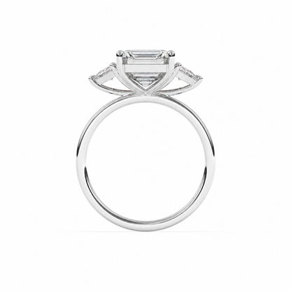 Emerald-cut diamond three-stone ring with trillion diamond shoulders