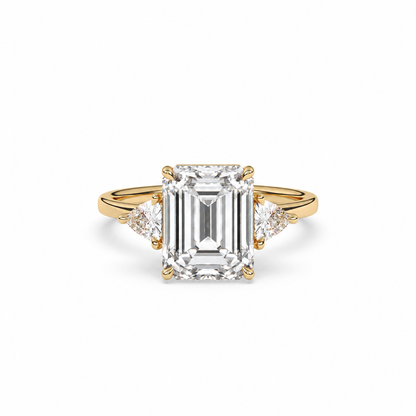 Emerald-cut diamond three-stone ring with trillion diamond shoulders