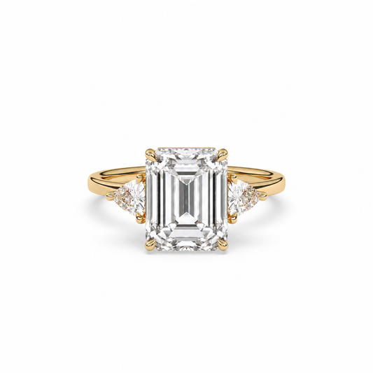 Emerald-cut diamond three-stone ring with trillion diamond shoulders