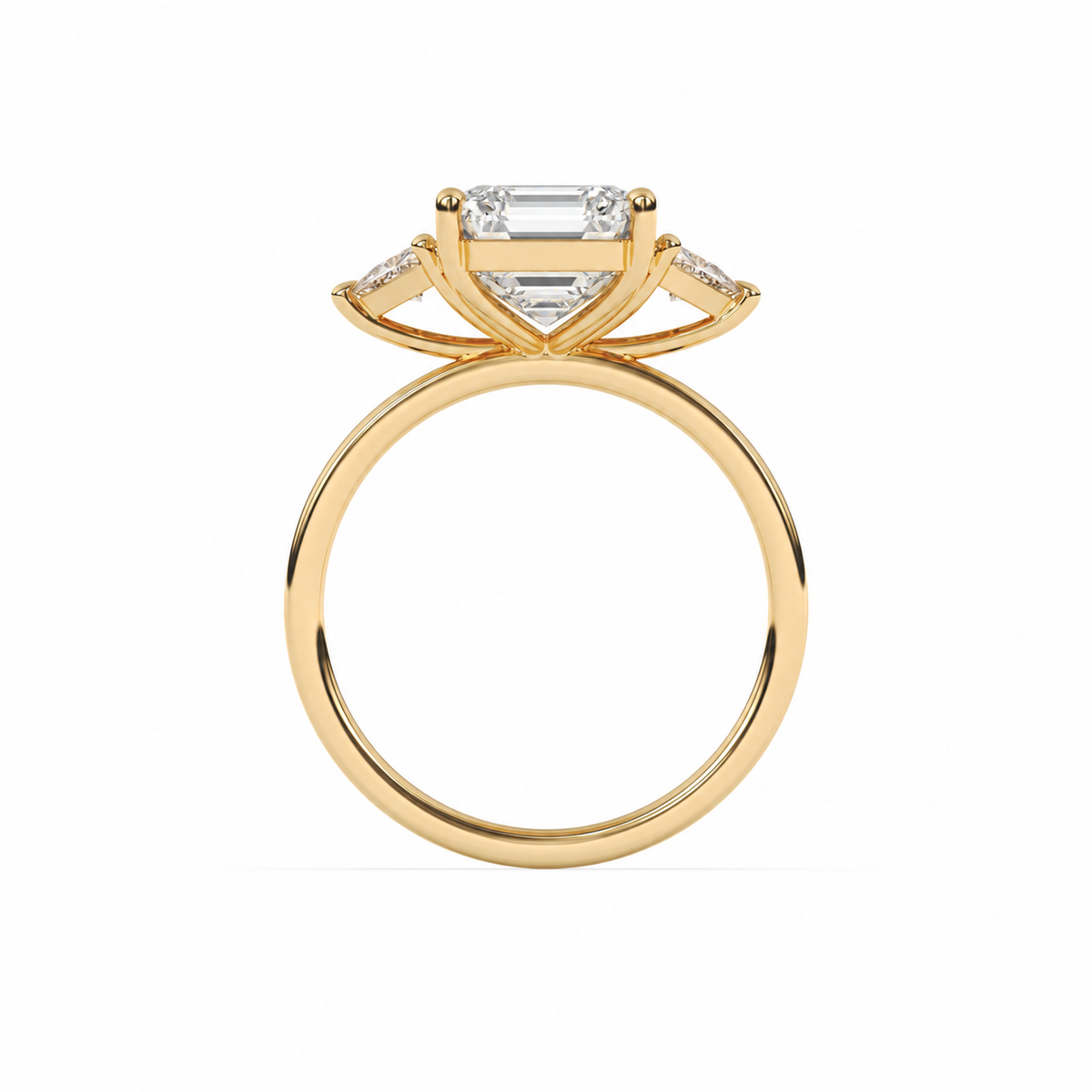 Emerald-cut diamond three-stone ring with trillion diamond shoulders