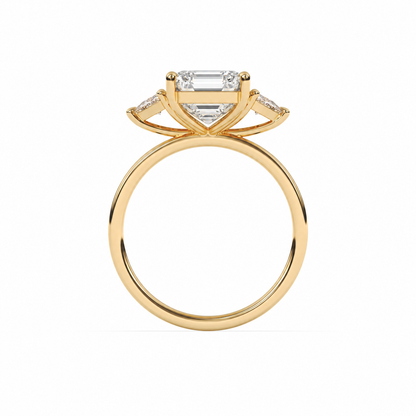 Emerald-cut diamond three-stone ring with trillion diamond shoulders