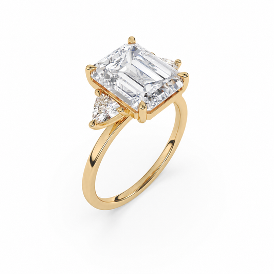 Emerald-cut diamond three-stone ring in 18k yellow gold