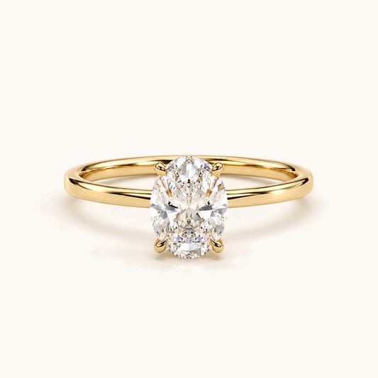 Four-claw oval lab-grown diamond solitaire engagement ring in 18k yellow gold