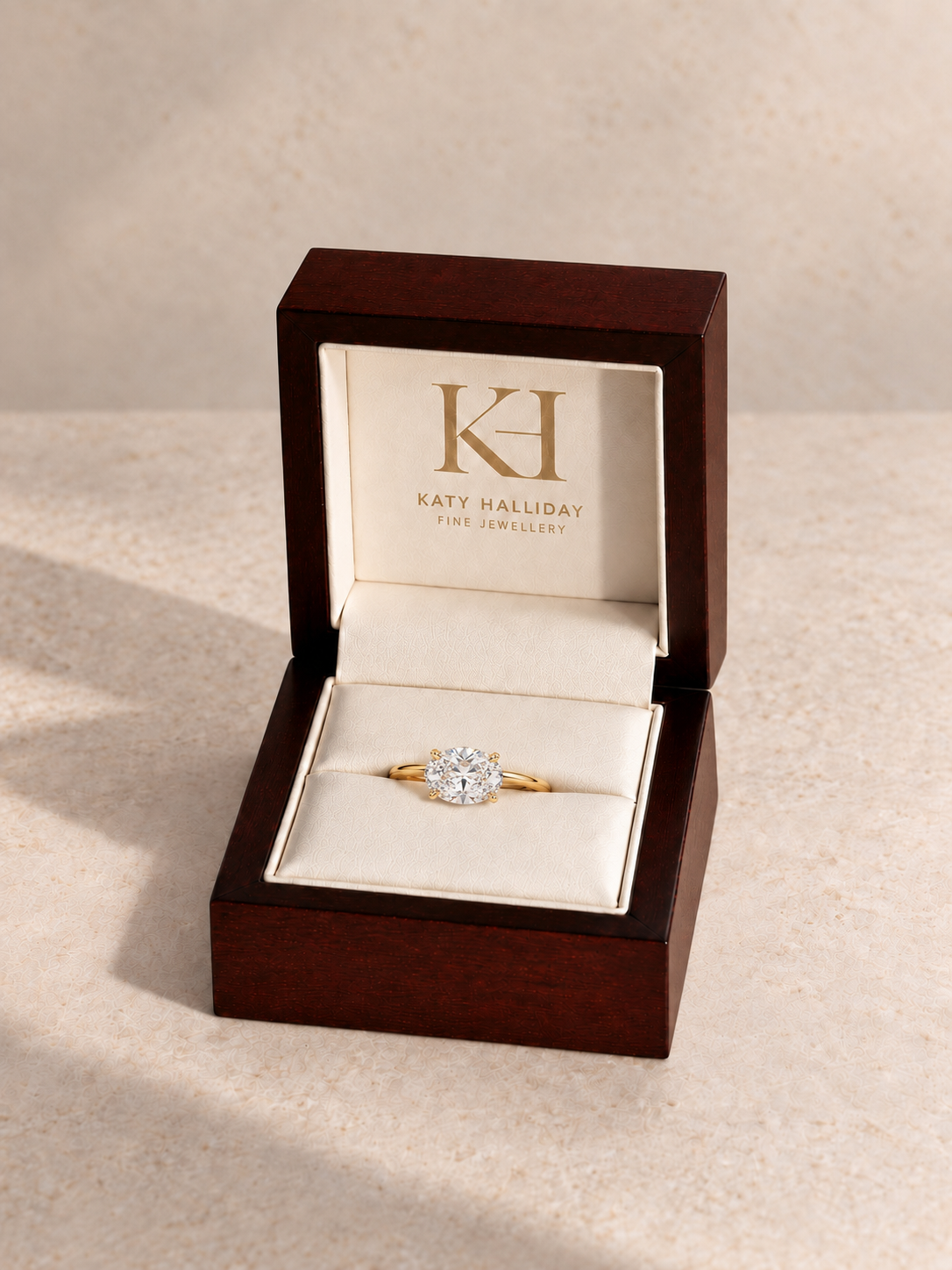 Katy Halliday wooden presentation box with east-west oval brilliant solitaire