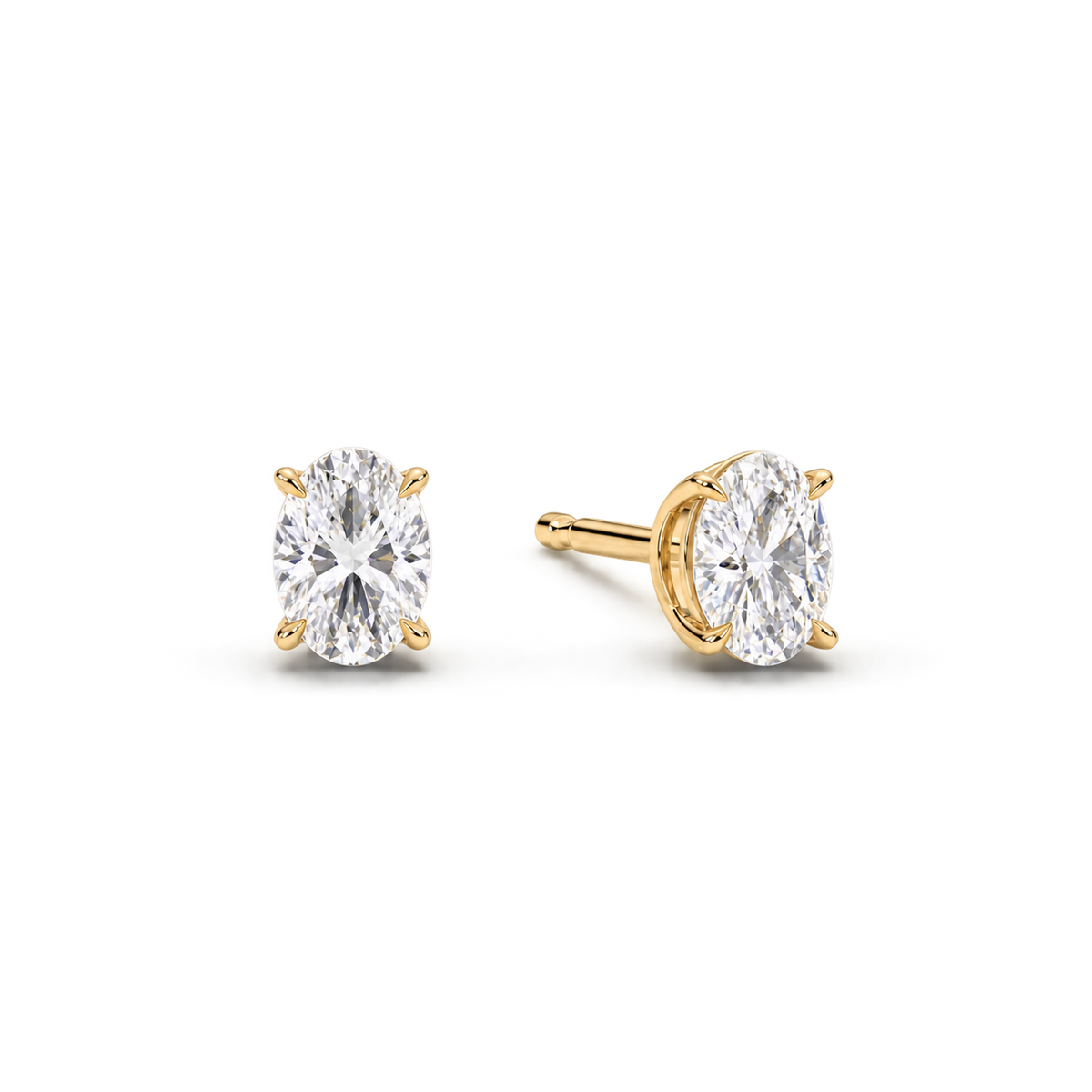 Oval diamond earrings, 1.5ct total pair weight, yellow-gold, angled; RB setting style