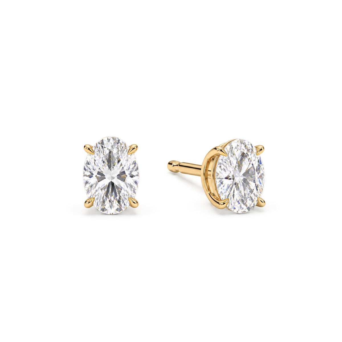 Oval diamond earrings, 2ct total pair weight, yellow gold, angled view