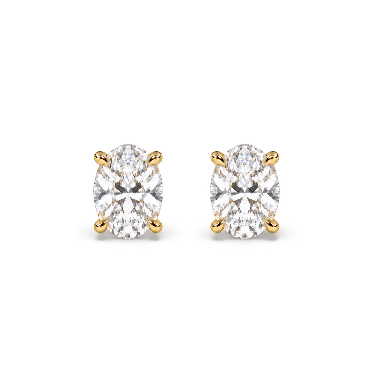 Oval diamond studs, 2ct total pair — 1ct each — yellow gold, front view