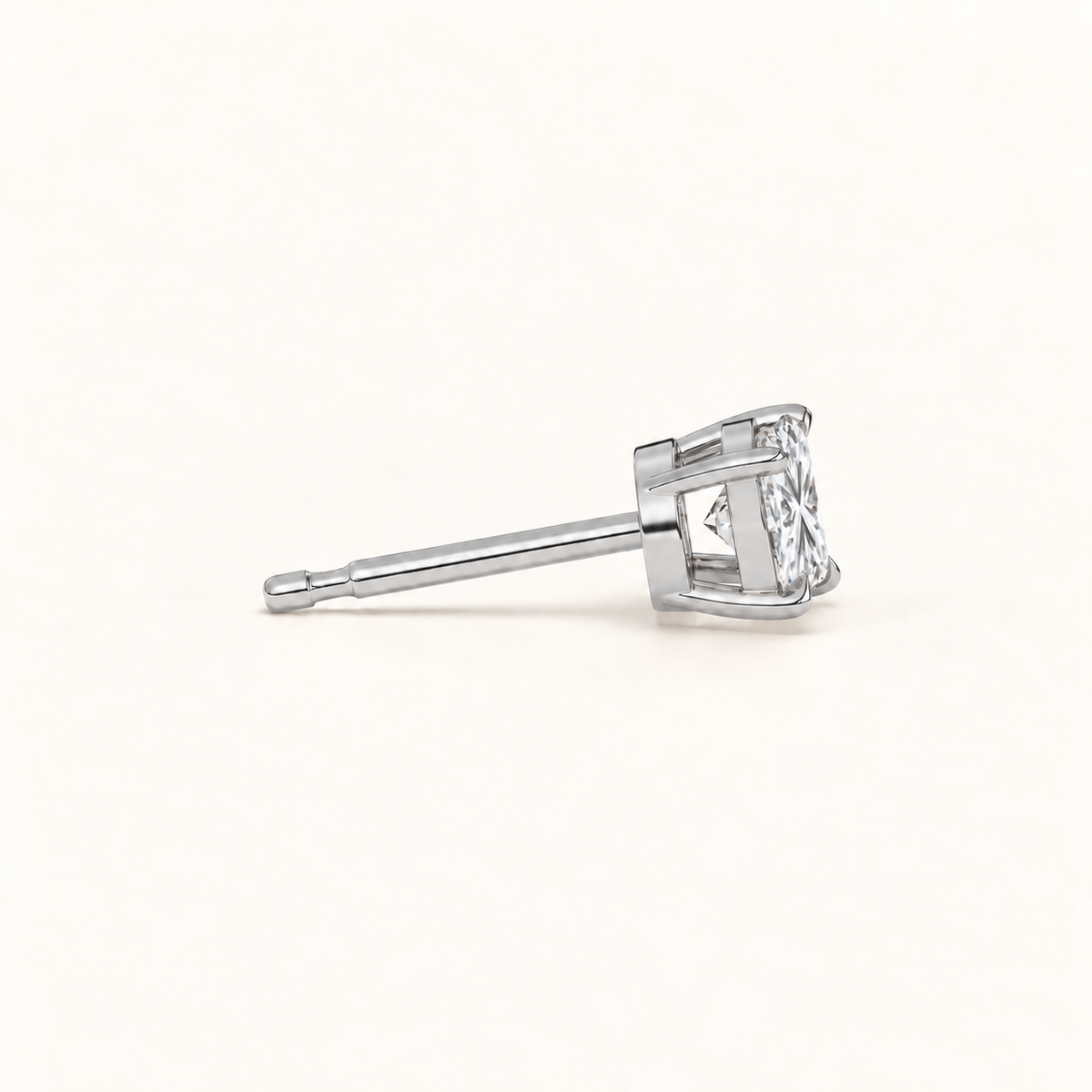 Princess-cut diamond stud earrings, 1 total carat weight, platinum — side