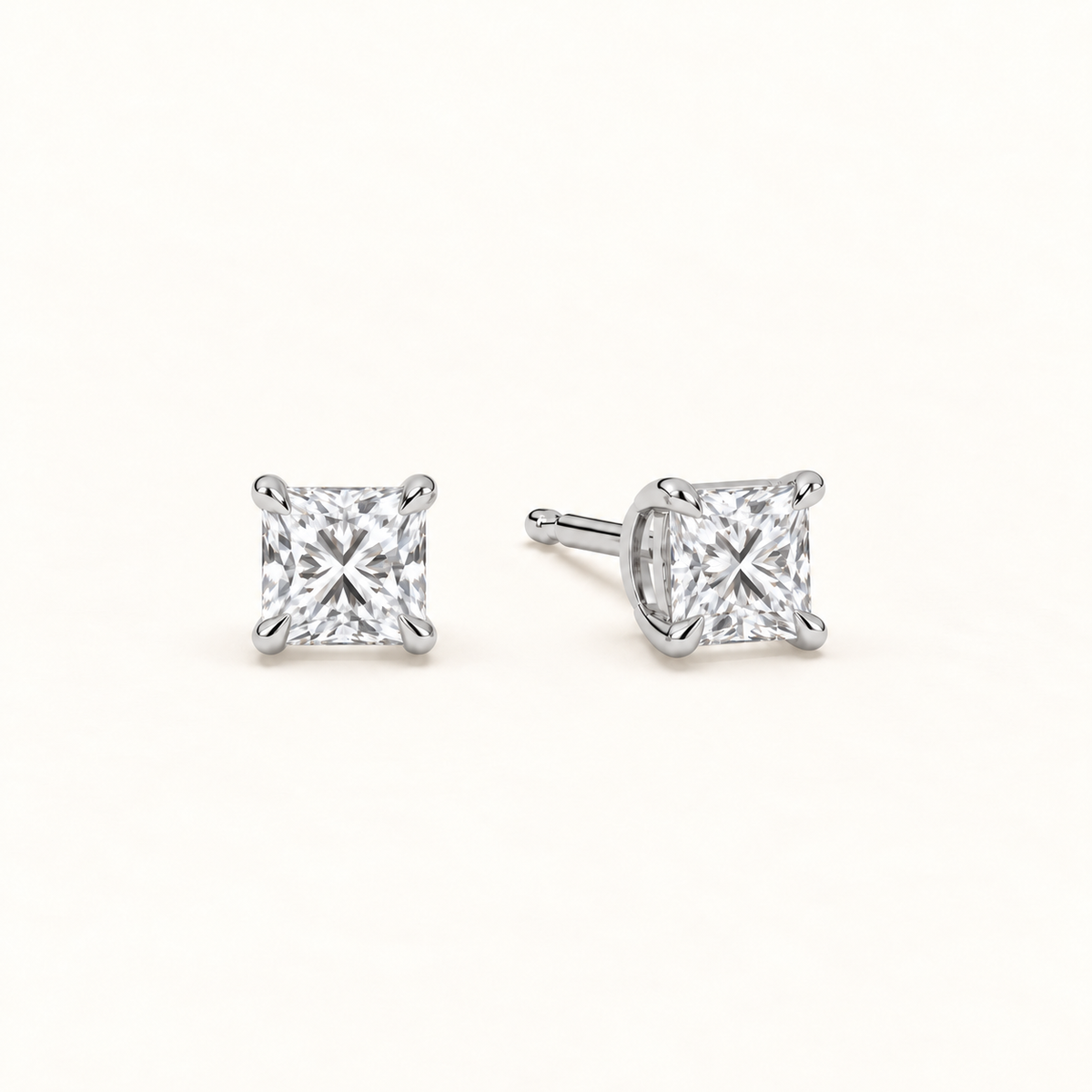 Princess-cut diamond stud earrings, 1.5 total carat weight, white gold — angled