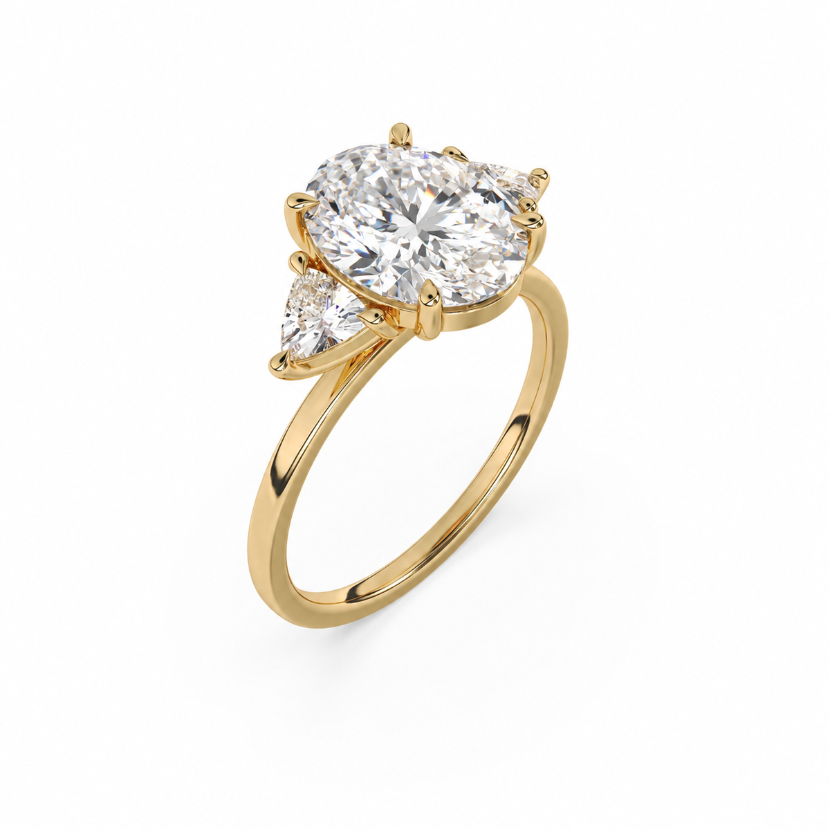 Three-quarter view of an oval diamond three-stone ring in yellow gold with trillion diamond shoulders