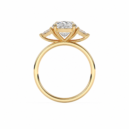 Side gallery view of an oval diamond three-stone ring in yellow gold with trillion diamond shoulders
