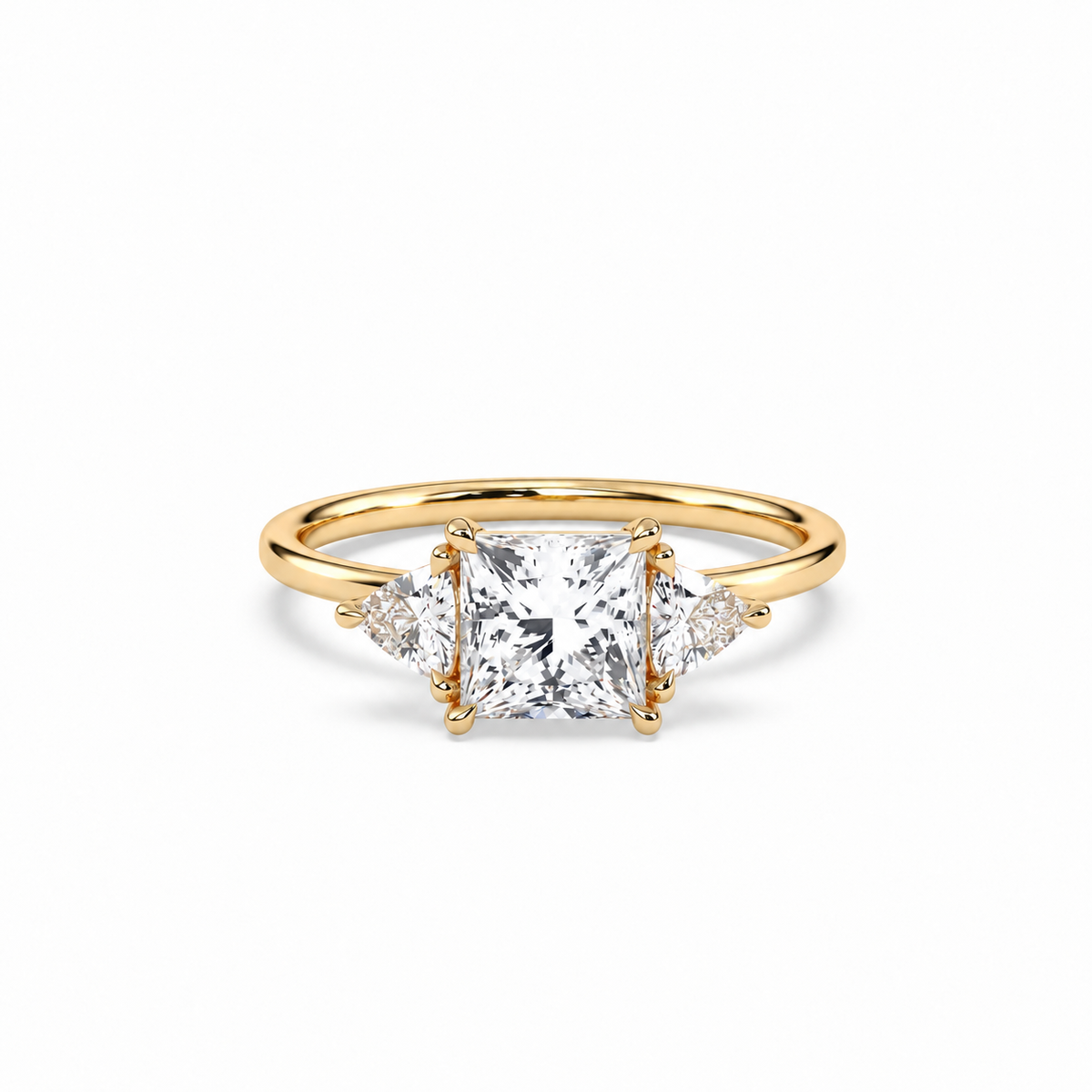 Princess and trillion diamond ring in yellow gold, lying-down view with approved solitaire shank profile
