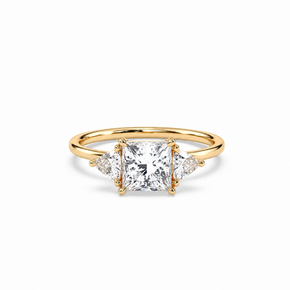 Princess and trillion diamond ring in yellow gold, lying-down view with approved solitaire shank profile